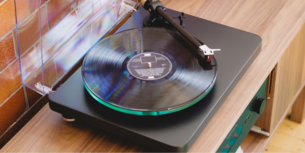 banner turntable|The first manufactured LP released by Columbia Records|Vitalogy album in 1994 on vinyl|Turntable|Gramophone record made of shellac